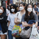 In Seoul, Chinese tourists wore masks as a precaution against MERS.